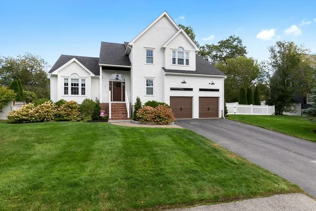 a view of house with yard and green space