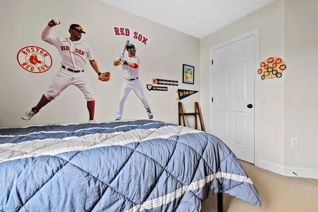 a bedroom with a bed and a table