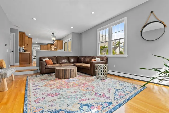 a living room with a couch and a dining table