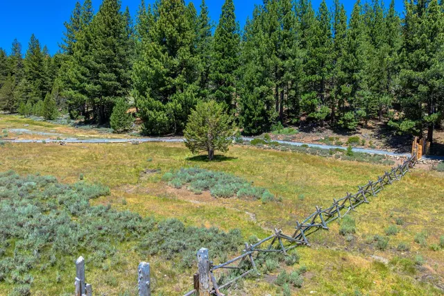 a view of a swimming pool with an outdoor space and seating area