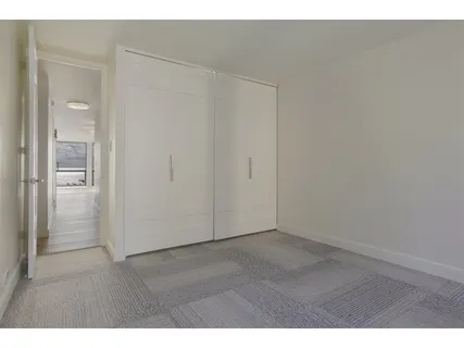 a view of a lake with houses in the back