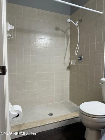 a bathroom with a bathtub and shower