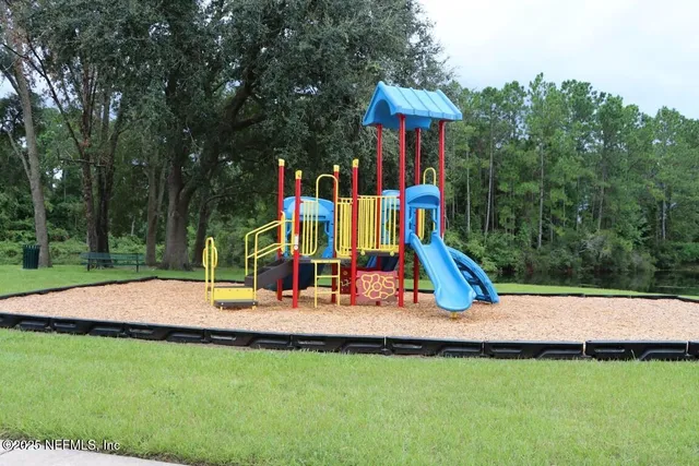 a view of a backyard with a slide