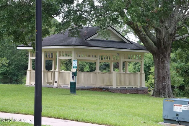 a view of a park with large trees