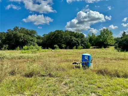a view of a golf area with a yard