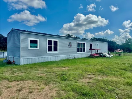 a living room with stainless steel appliances kitchen island granite countertop furniture and a kitchen view