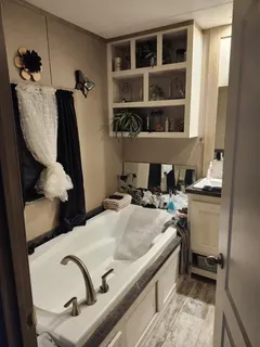a bathroom with a sink vanity and a mirror