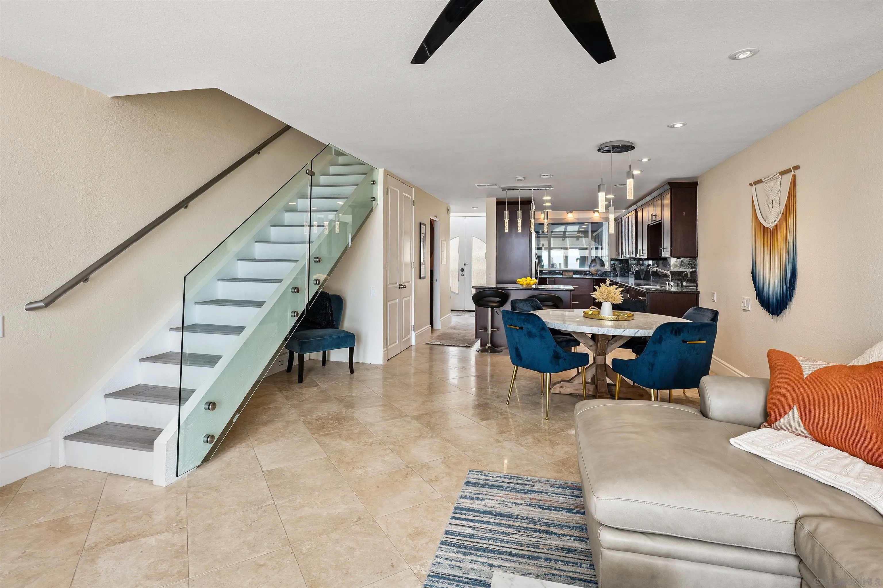 920 Sealane Drive, Unit B Encinitas, CA 92024 - Photo 4 of 10 a living room with furniture a rug and white walls