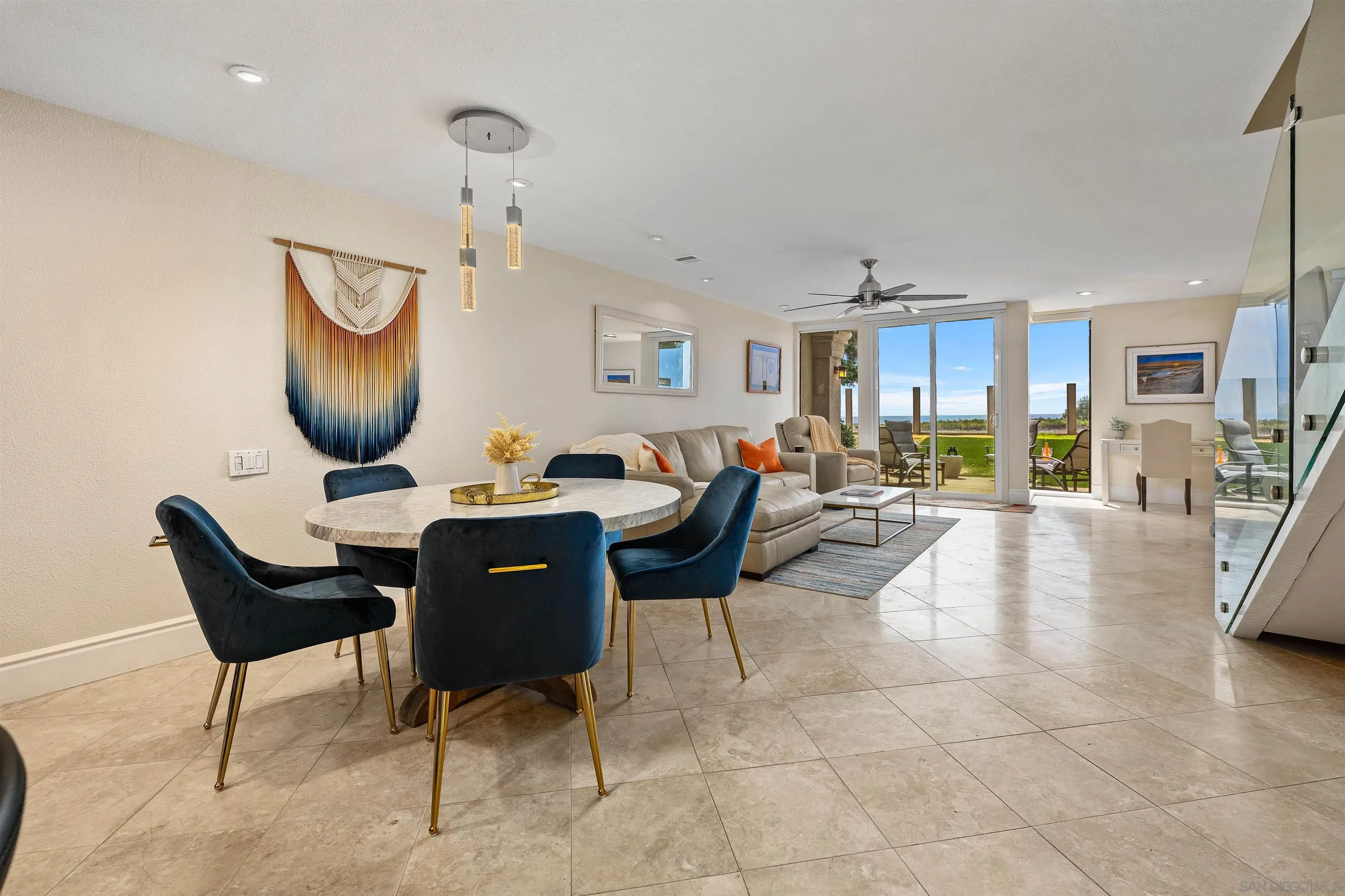 920 Sealane Drive, Unit B Encinitas, CA 92024 - Photo 5 of 10 a living room with furniture a flat screen tv and kitchen view