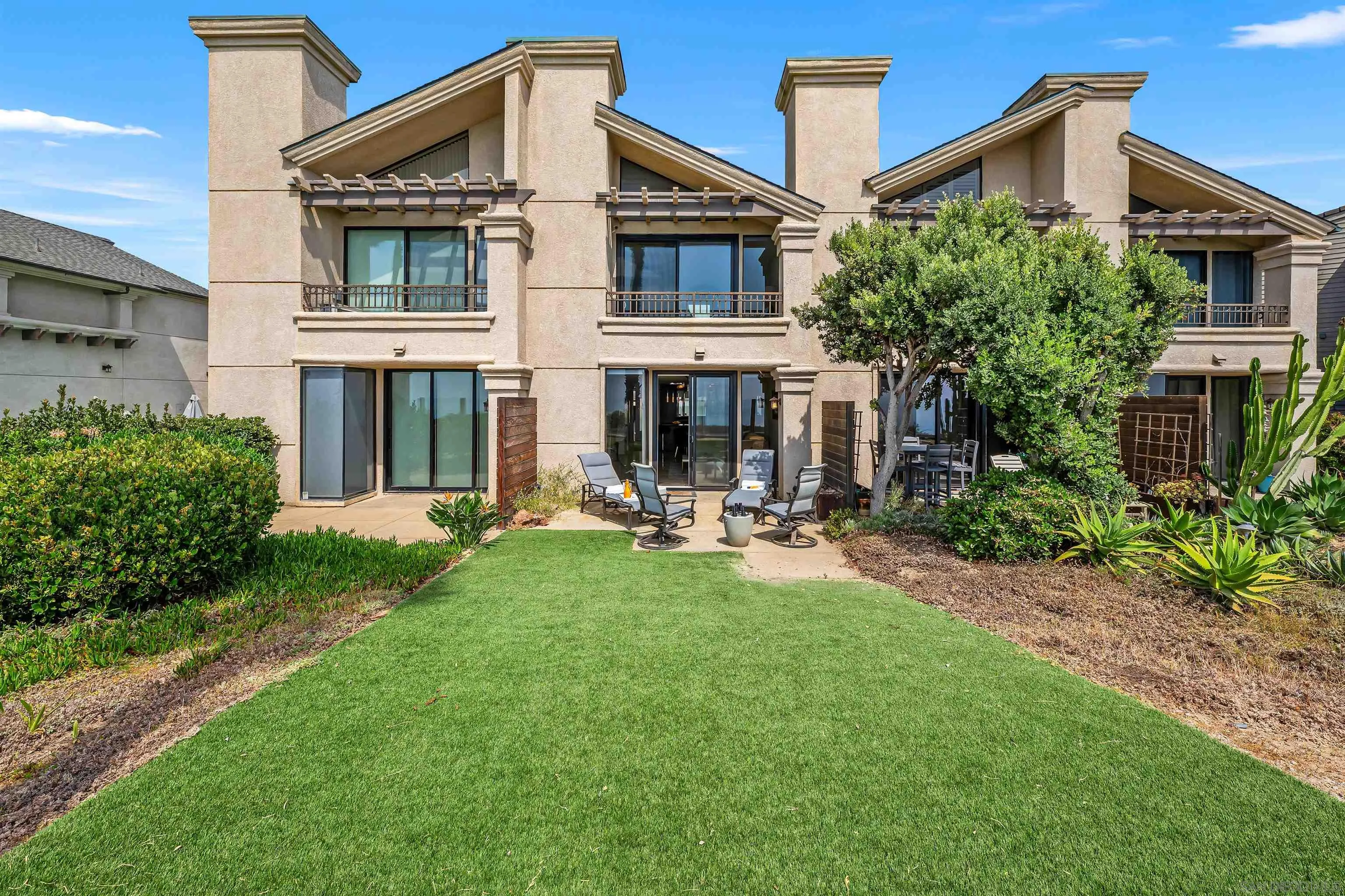 920 Sealane Drive, Unit B Encinitas, CA 92024 - Photo 7 of 10 a view of a house with backyard and sitting area