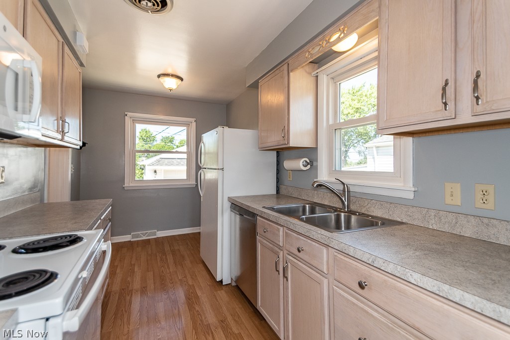 1854 Rush Road Wickliffe, OH 44092 - Photo 8 of 31 Clean and efficient kitchen with neutral colors. Dishwasher and garbage disposal new in 2021