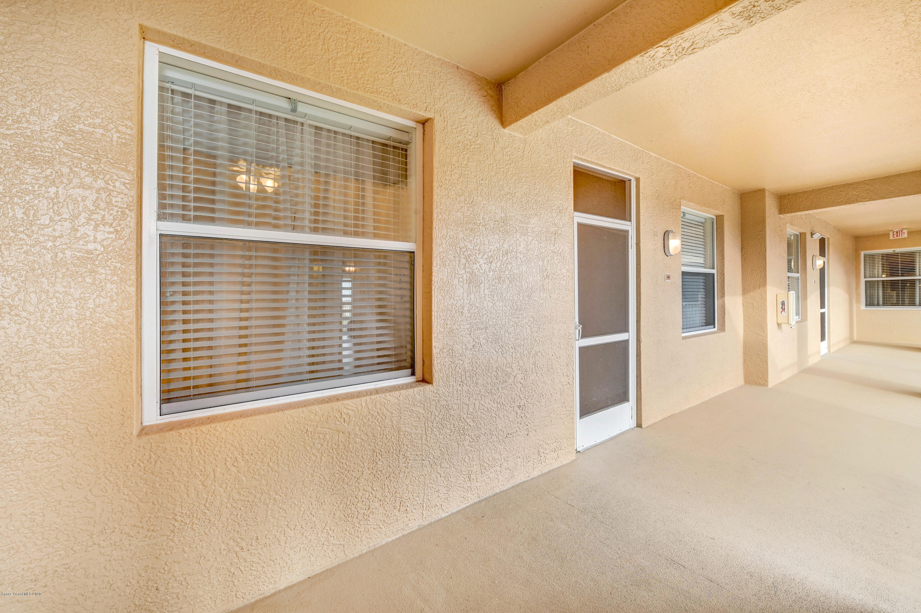 6848 Toland Drive, Unit 404 Melbourne, FL 32940 - Photo 19 of 36 Entry Screened Door