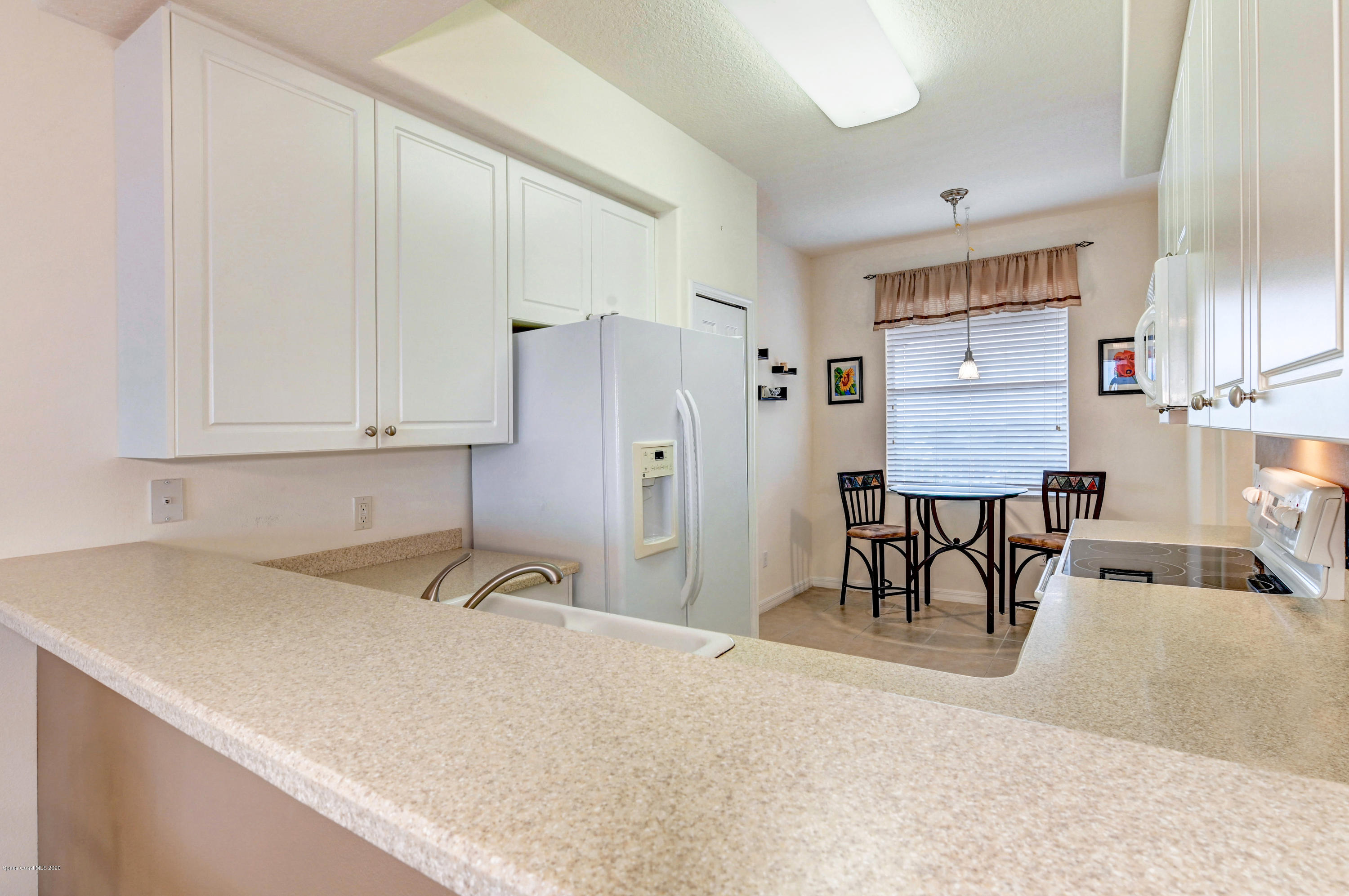6848 Toland Drive, Unit 404 Melbourne, FL 32940 - Photo 7 of 36 Breakfast Bar/Counter