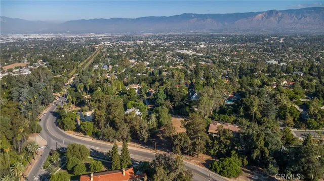 an aerial view of residential house and green space
