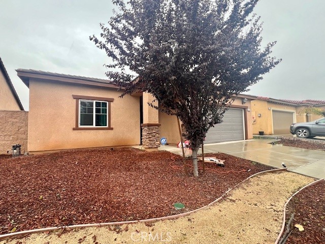 34434 Solstice Street Winchester, CA 92596 - Photo 5 of 11 a view of a house with backyard and trees