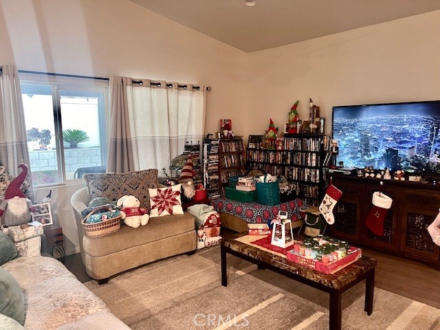 34434 Solstice Street Winchester, CA 92596 - Photo 6 of 11 a living room with furniture and a floor to ceiling window