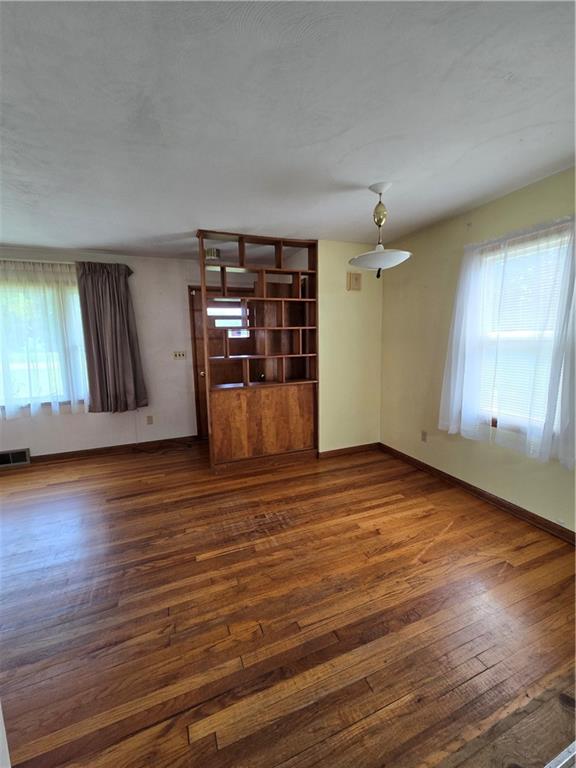 472 Portman Road Butler, PA 16002 - Photo 10 of 30 an empty room with wooden floor and windows