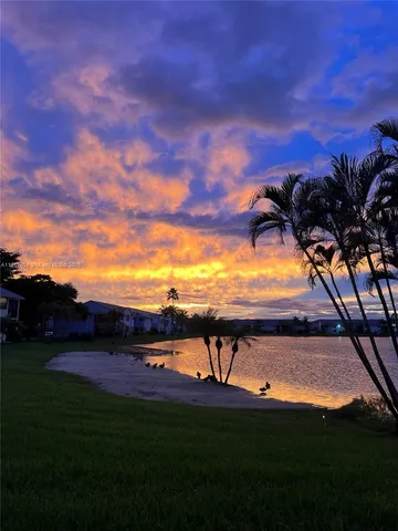 a view of swimming pool from a yard