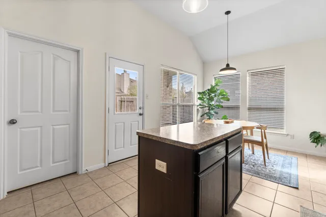 a kitchen with stainless steel appliances granite countertop a sink a counter top space and cabinets