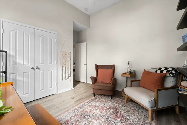 a living room with furniture and a rug