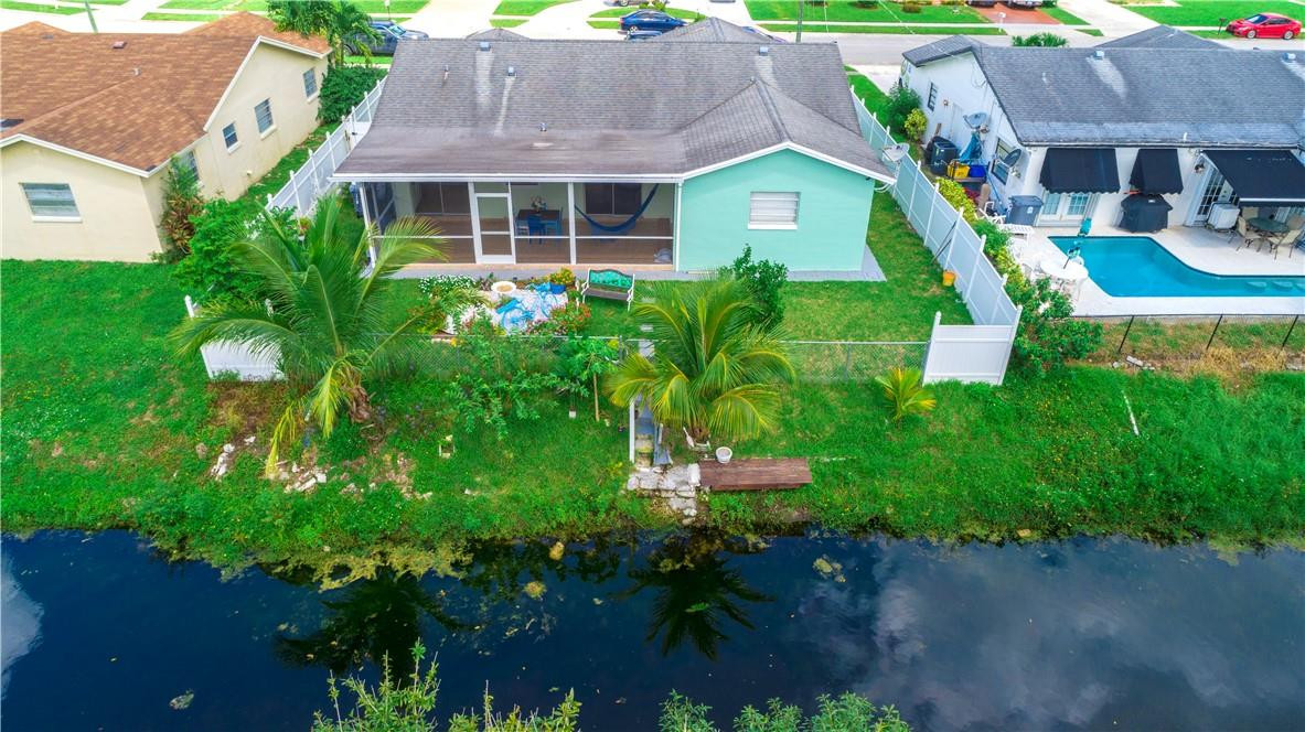 22202 Southwest 58th Avenue Boca Raton, FL 33428 - Photo 35 of 39 a aerial view of a house with a garden and plants