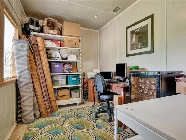 a view of a workspace with furniture