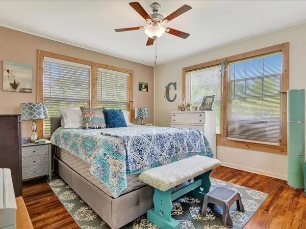a bedroom with a bed and window