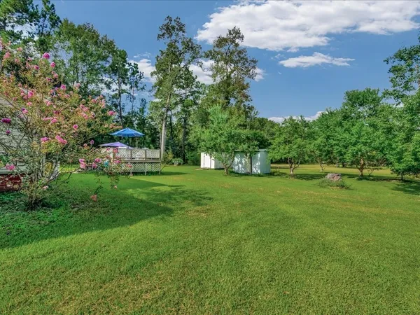 a view of green field with sitting area