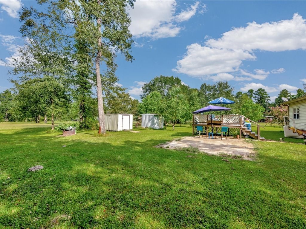 635 Oscar Berry Road Lufkin, TX 75904 - Photo 24 of 36 a view of a house with a yard and sitting area