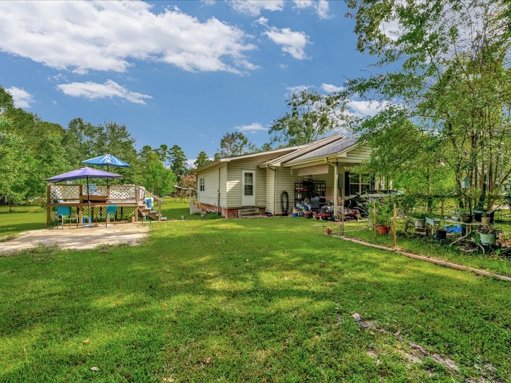 635 Oscar Berry Road Lufkin, TX 75904 - Photo 25 of 36 a front view of a house with a garden and trees