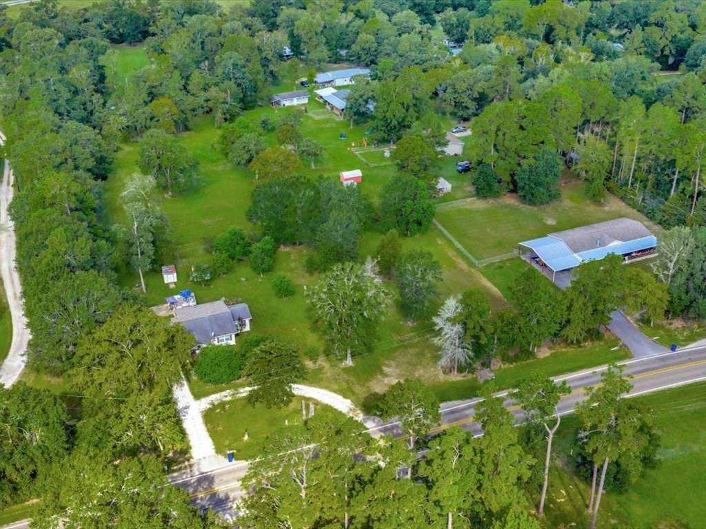 635 Oscar Berry Road Lufkin, TX 75904 - Photo 28 of 36 an aerial view of residential houses with outdoor space and trees