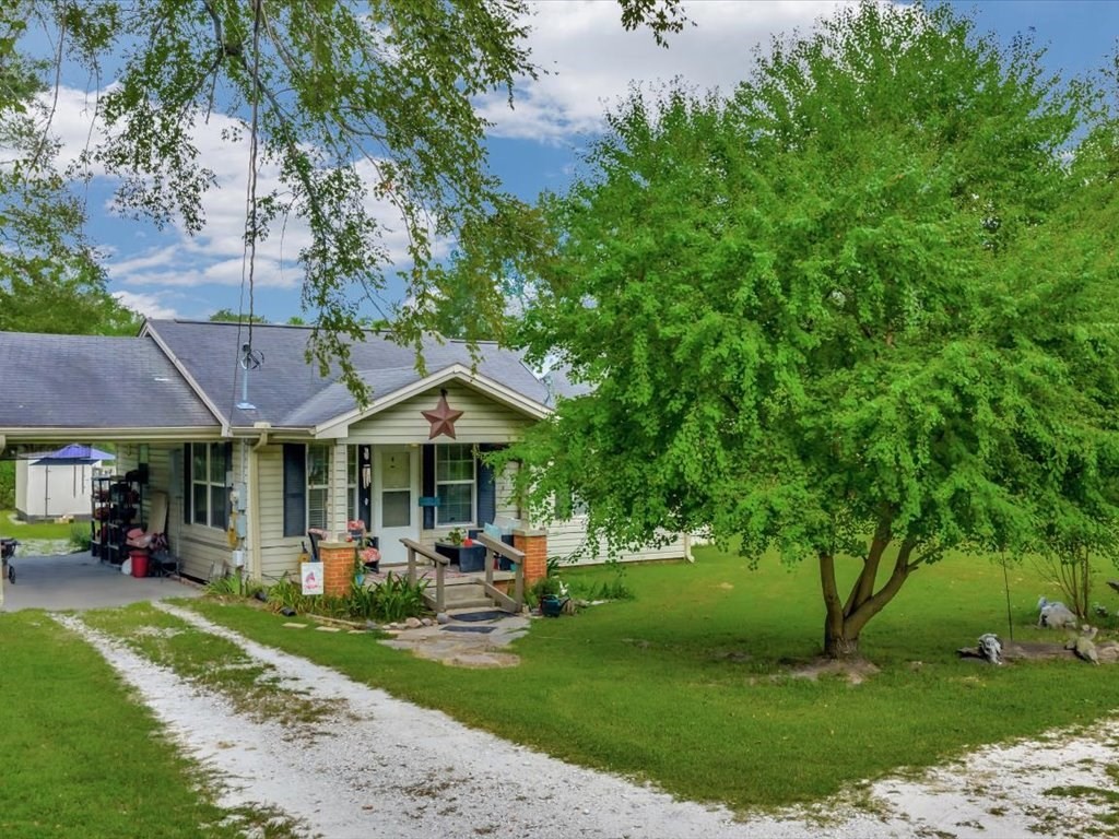 635 Oscar Berry Road Lufkin, TX 75904 - Photo 31 of 36 a front view of a house with garden and trees