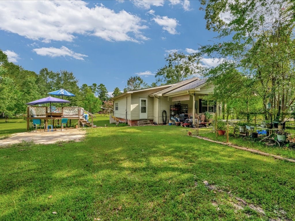 635 Oscar Berry Road Lufkin, TX 75904 - Photo 34 of 36 a front view of a house with a garden and trees