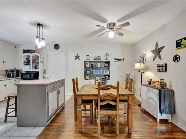 a view of kitchen with cabinets and wooden floor