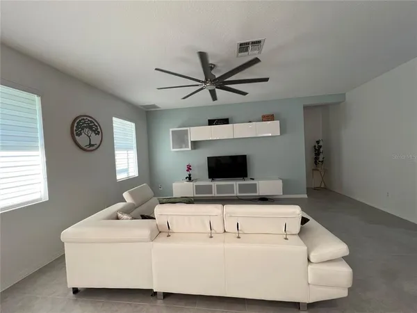 a kitchen with kitchen island granite countertop stainless steel appliances cabinets a sink and a counter top space