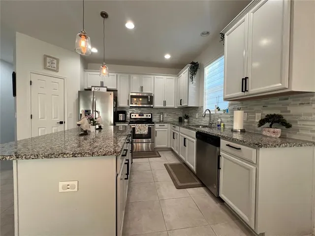 a view of an empty room and a window