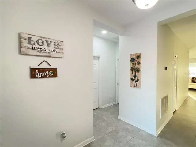 a view of a lake with houses in the back