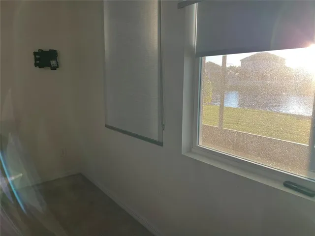 a view of a wooden slide with a backyard