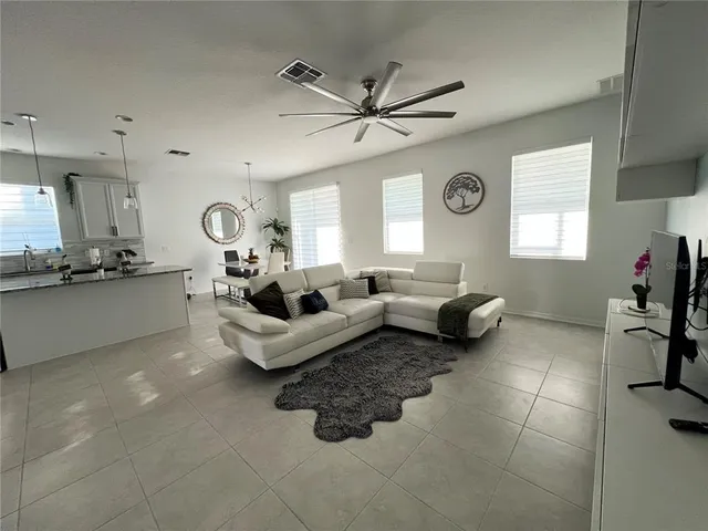 a living room with furniture and a window