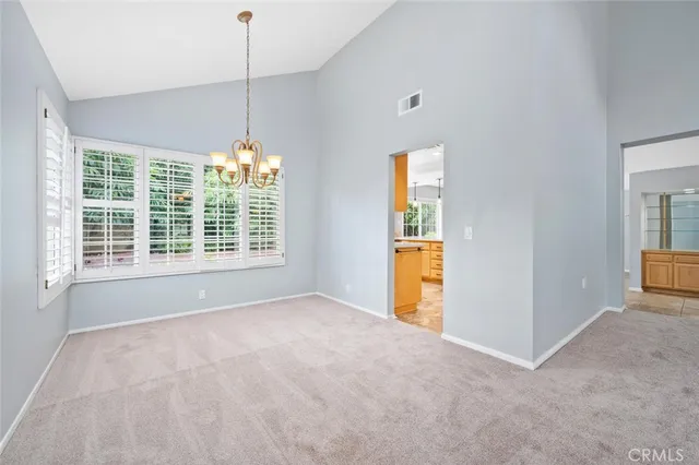 a kitchen with granite countertop cabinets sink and window