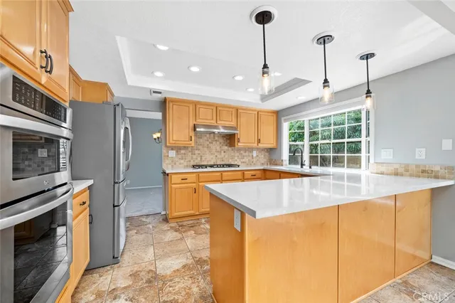 a view of a bedroom with a ceiling fan