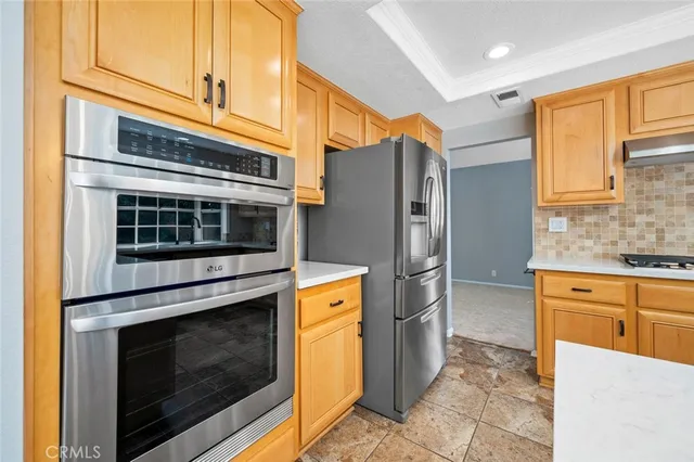 a view of a room with a window and a ceiling fan