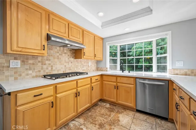 a view of a livingroom with a fireplace and a ceiling fan