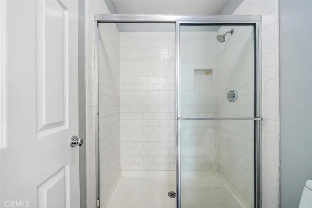 a backyard of a house with plants and garage