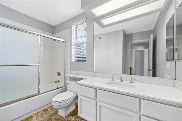 an aerial view of residential houses with outdoor space and street view