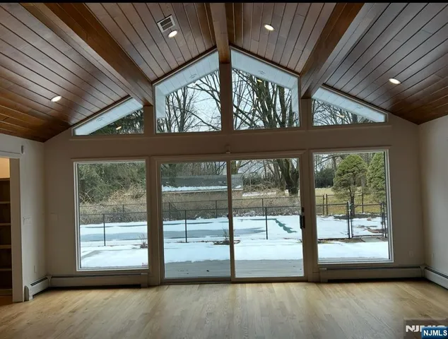 a view of an empty room with a balcony