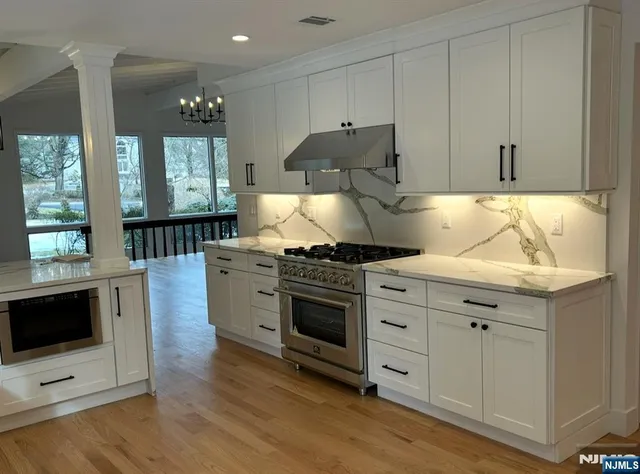 a kitchen with a stove and a sink