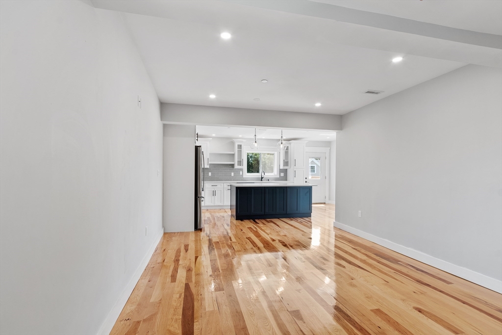 67 Essex Street, Unit 2 Salem, MA 01970 - Photo 11 of 35 a view of a bedroom with wooden floor