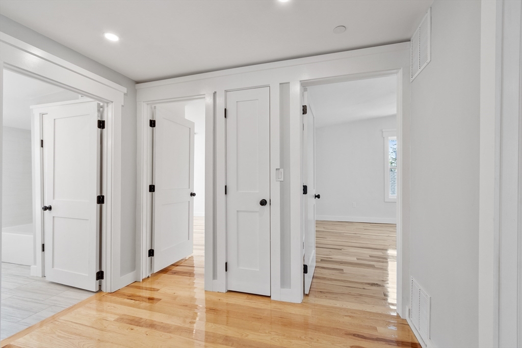 67 Essex Street, Unit 2 Salem, MA 01970 - Photo 16 of 35 a view of a hallway with wooden floor