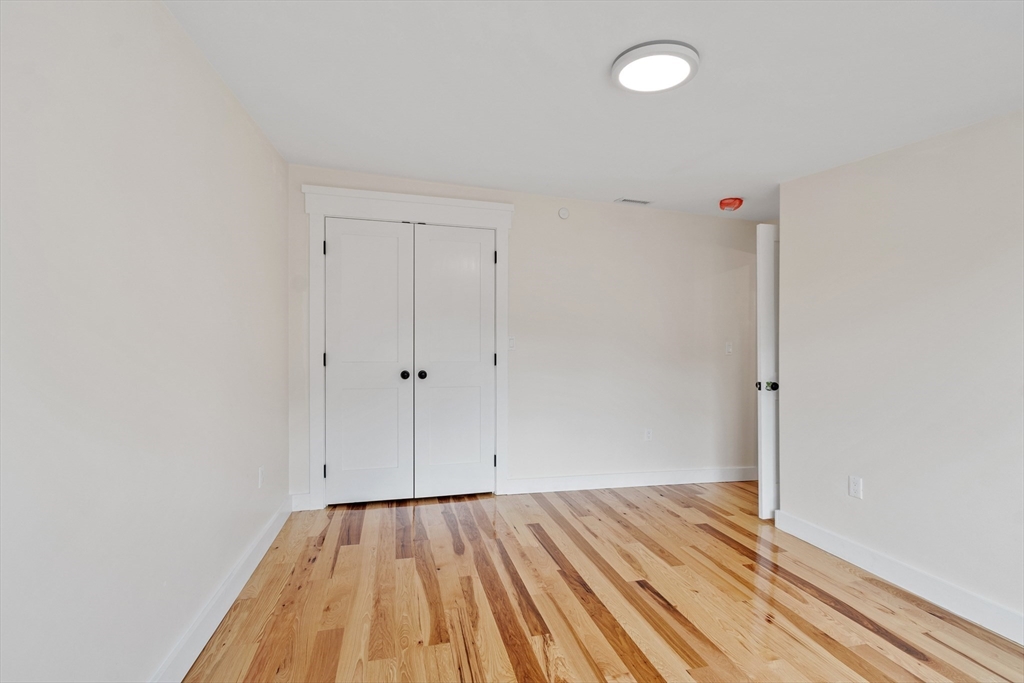 67 Essex Street, Unit 2 Salem, MA 01970 - Photo 25 of 35 a view of room with wooden floor